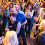 Leaders Credit Union employees celebrate. Leaders Credit Union