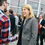 Caren Gabriel shakes an attendee's hand at the Murfreesboro Branch Grand Opening in 2017.
