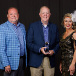 David Smart, president and CEO of Trust Federal Credit Union, was named the TriStar Advocate of the Year. Fred Robinson, president and CEO of the League, and Sarah Waters, chief advocacy officer, presented the award. Event photography by Dan Henry Photography.