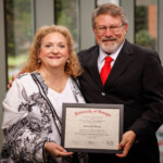 Beth Sharpe, president/CEO of HealthNet Federal Credit Union, graduates from the Southeast CUNA Management School.