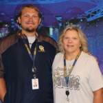 A mother-and-son teaching duo looks forward to having their picture made every year at Appalachian Community Federal Credit Union's back-to-school photo booth.
