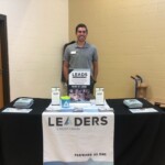 A representative from Leaders Credit Union attends a vendor fair at a teacher in-service event.