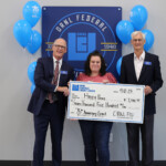Happy Paws receives a grant from ORNL Federal Credit Union in honor of the credit union's 75th anniversary.