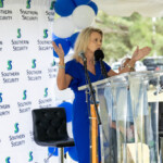 Dawn Graeter, president and CEO of Southern Security Federal Credit Union, speaks to groundbreaking ceremony attendees.