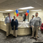 The Tennessee Credit Union employees display the array of treats for members on International Credit Union Day.