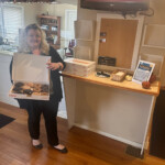 The Tennessee Credit Union employees display the array of treats for members on International Credit Union Day.
