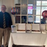 The Tennessee Credit Union employees display the array of treats for members on International Credit Union Day.