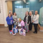 TVFCU's Chickamauga Branch showcases their donations to benefit North Georgia's Stocking Full of Love program.