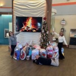 TVFCU's Hamilton Place Branch display their donations for the Salvation Army's Angel Tree Program.