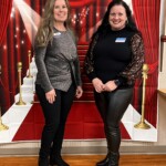 Kim Bohannon, chief innovation officer at the Tennessee Credit Union, and Melanie Buchanan, chapter officer, stand before the red carpet photo theme.