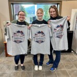 Appalachian Community Federal Credit Union employees display the new T-shirts.