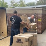 Employees from Knoxville TVA Employees Credit Union load supplies for relief efforts in Northeast Tennessee.