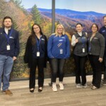 ORNL Federal Credit Union employees showcase their International Credit Union Day pins. The credit union commemorated the day by making a donation to East Tennessee Children's Hospital and the World Council of Credit Unions.