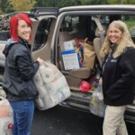 Employees from UT Federal Credit Union collect items for hurricane relief efforts.