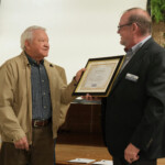 Fred Robinson, president and CEO of the Tennessee Credit Union League, presents a certificate to Bill Swafford, as he retires from the board of Chattanooga Federal Employees Credit Union.