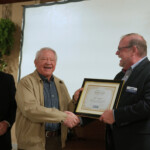Fred Robinson, president and CEO of the Tennessee Credit Union League, presents a certificate to Bill Swafford, as he retires from the board of Chattanooga Federal Employees Credit Union.