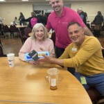 Jeff Panko, key account executive with Volcorp, awards a carton of eggs as part of the door prize.
