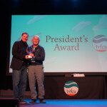 Todd Fortner, president and CEO at TVFCU, awards the President's Award to Mike from the Collections Department.