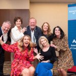 League staff and League board members pose with Fred at the Farley Award Reception.