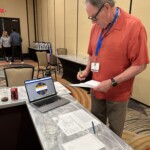 Credit union chapter leaders participate in an interactive reality fair simulation.