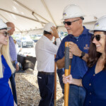 Attendees gather at Enrichment Federal Credit Union's groundbreaking ceremony.