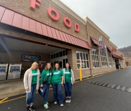 Credit union volunteers at the Food City in Erwin.