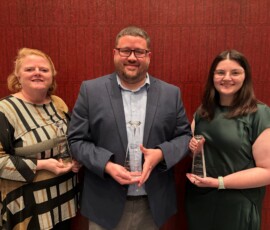 The Heritage South Marketing Team holds their awards. From left: Kalyn Catlett, business development representative; Wes Trundle, vice president of marketing; and Jordan Monty, digital marketing specialist.