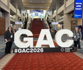 Trust Federal Credit Union attendees with the GAC sign.