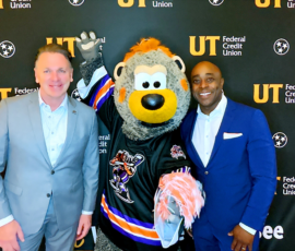 Kenyon Warren, president and CEO of UT Federal Credit Union (far right) and Mike Murray, general manager of the Knoxville Ice Bears (far left) gather for a photo with Chilly Bear.