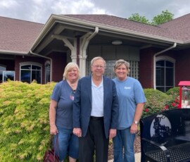 Clinchfield Federal Credit Union in Erwin, Tenn., hosts a member appreciation event in May 2022. Sandy Lingerfelt, retired CEO, Criss Browning, now retired director of business development at the League ambassador, and Amy Banks, current CEO, gather for a photo.