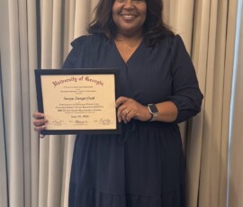 Sunya Dangerfield with Jack Daniel Employees' Credit Union after the graduation ceremony.