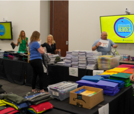 Southern Security Credit Union employees pack backpacks for the Youth Villages Backpack Heroes Campaign.