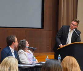 Jordan Barto with TVFCU presents during the debate.