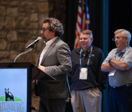 Matt Coniglio, emcee and AVP of advocacy, recognizes the winning golf team from the morning Charity Golf Tournament to benefit Inheritance of Hope.