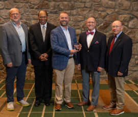 Fred Robinson recognizes the Ascend Federal Credit Union team for 75 years of service.