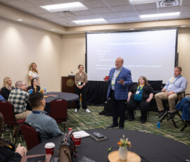 Fred Robinson, AnchorPoint president and CEO, speaks to the young professionals.