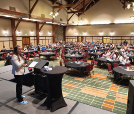 Chelsea Treboniak, credit union fraud expert, emcees the event.