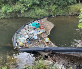 This little boom helps prevent litter from continuing to float downstream.